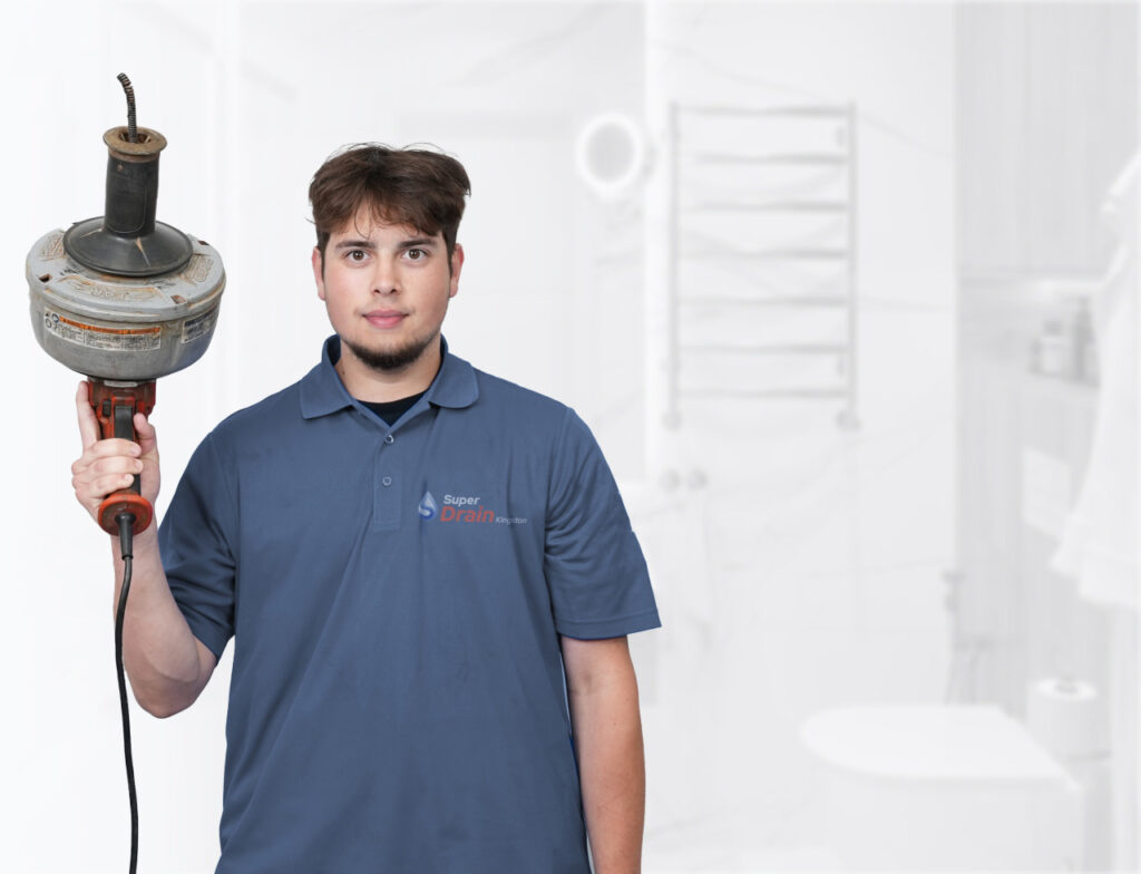 Kingston plumber using a mini snake for drain cleaning